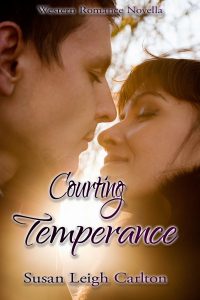 Closeup portrait of young kissing couple at sunshine